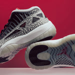 Air Jordan 11 Retro Low IE "Black Cement" - Black/Fire Red